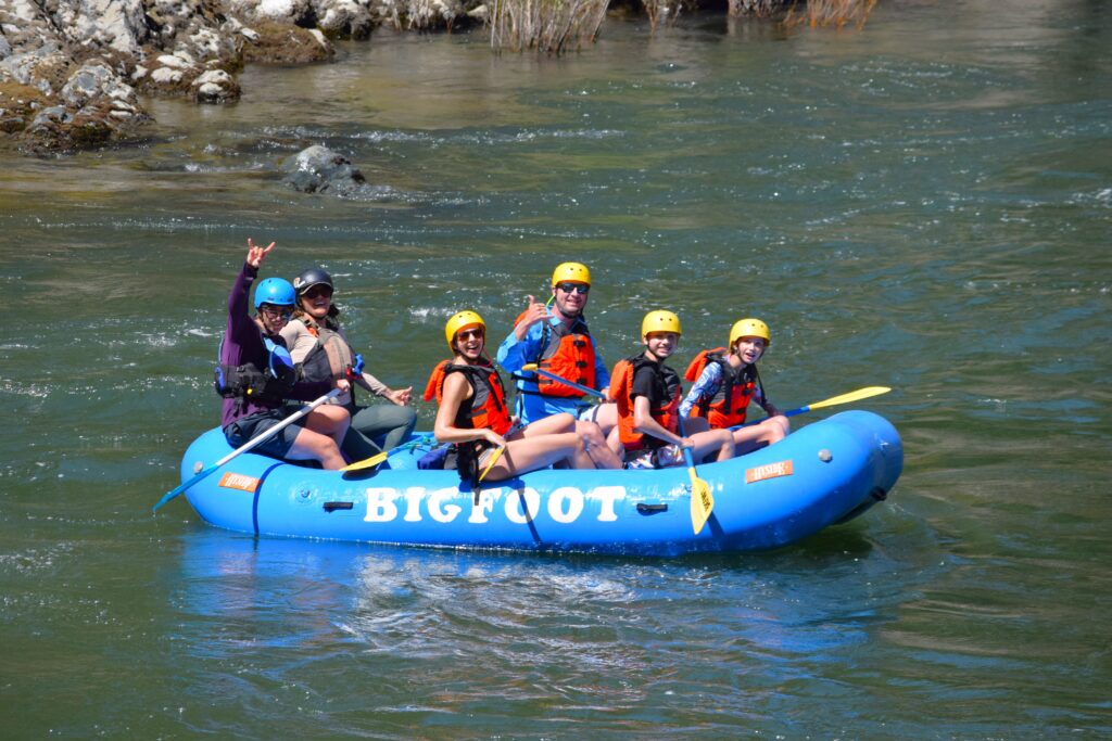 happy people posing for a picture on the water