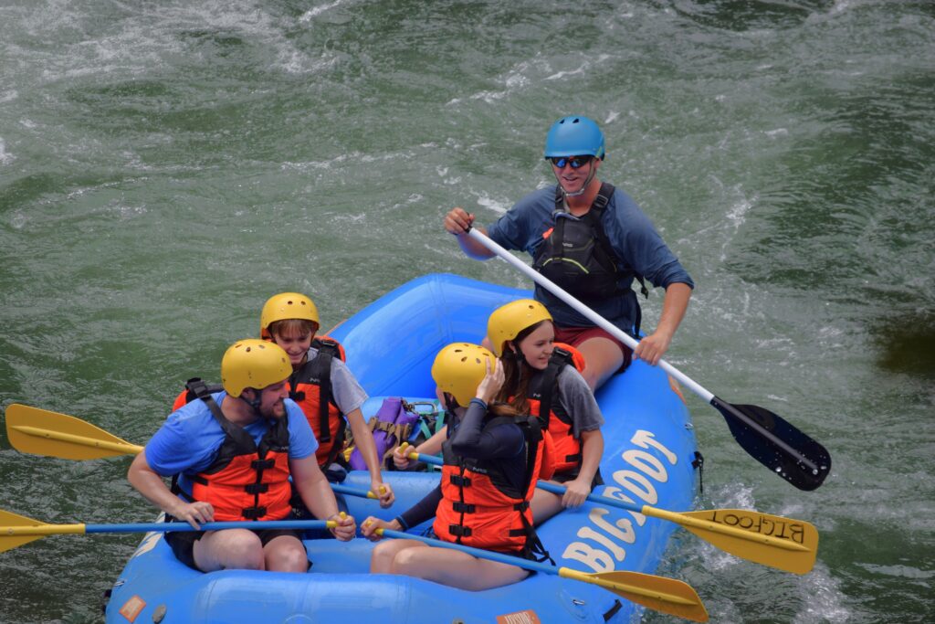 group of people coasting down the water