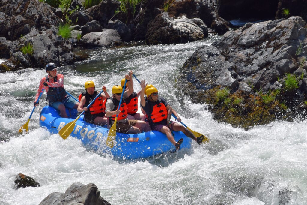 Group of people paddling a boat