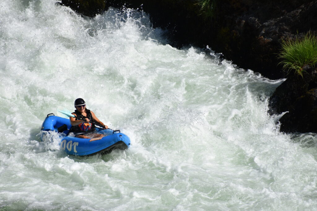 Solo rafter on the rapids